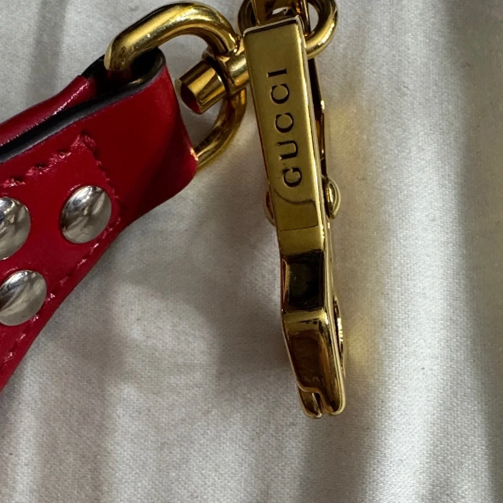Gucci Red Leather Eyelet Strap with Gold Clasp